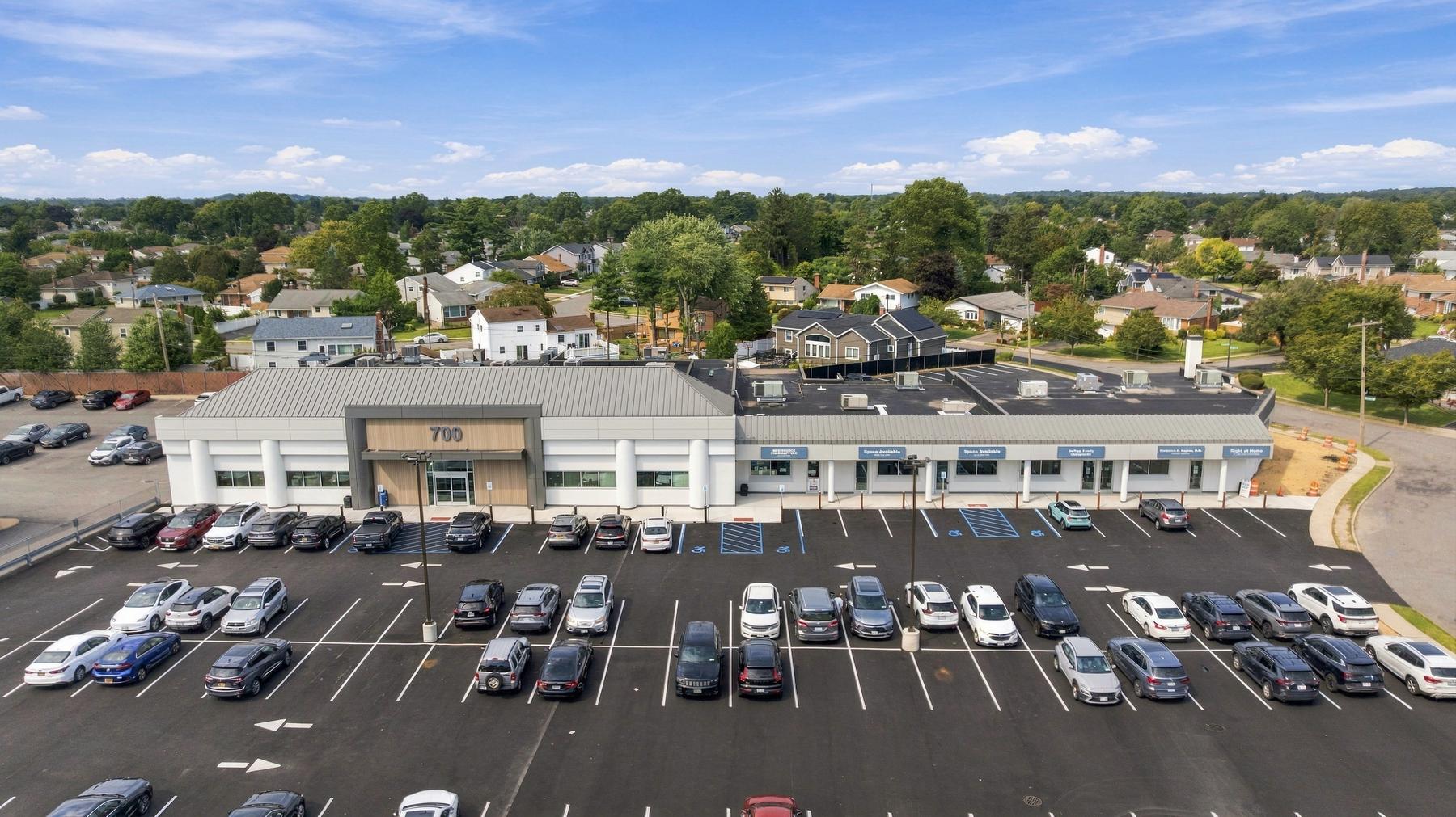 Aerial view of the building and parking field